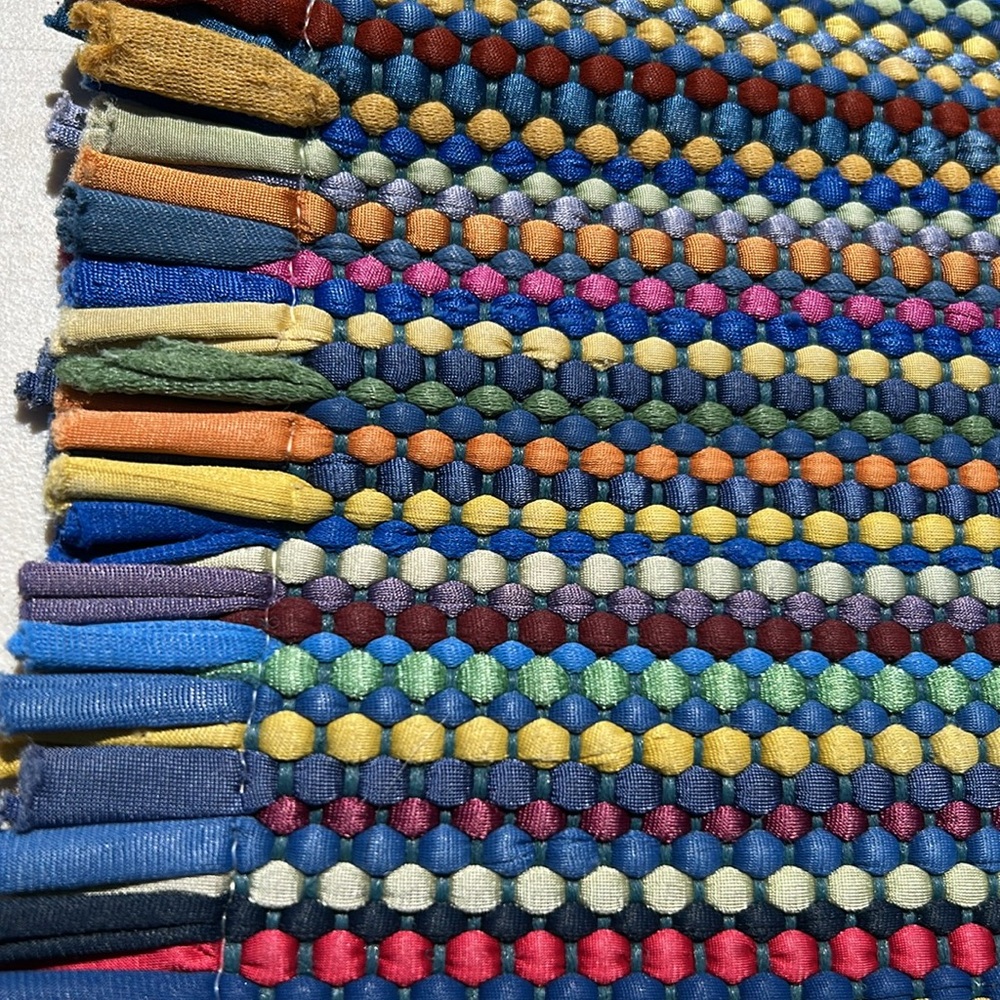 Colorful Woven Rug with Tassels.